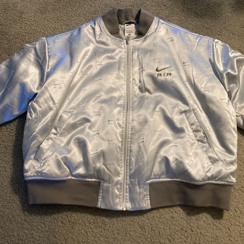 Woman’s Nike XL silver jacket